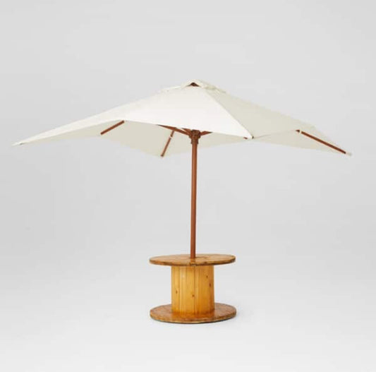 1 x large cable reel table + Market Umbrella furniture hire for events, weddings & celebrations. Contact Rockhampton Vintage Hire