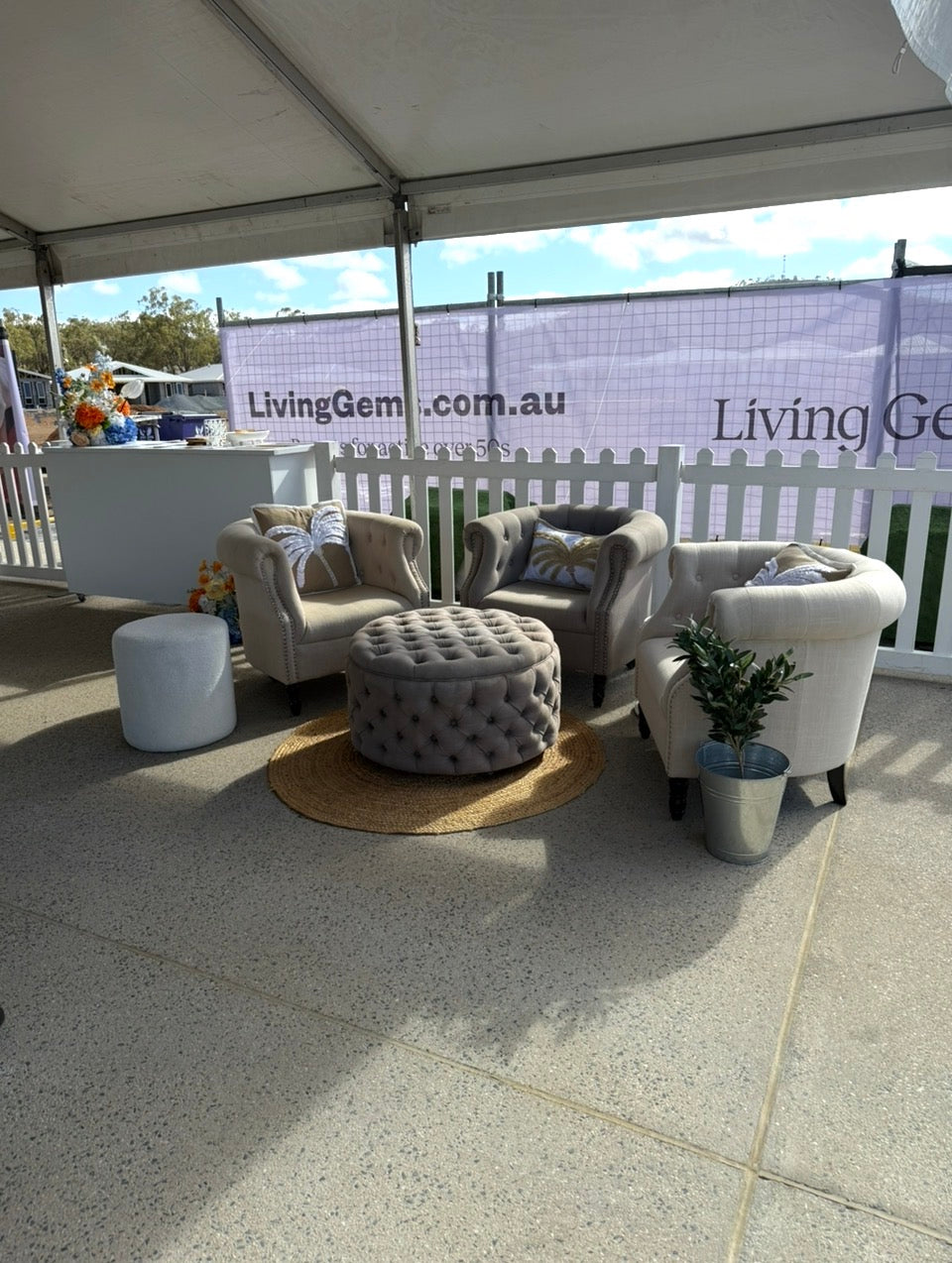 The tub chairs and ottoman lounge bundle from Rockhampton Vintage Hire featuring three beige tufted Chesterfield tub armchairs and a matching round tufted ottoman arranged as an event lounge setting. Rockhampton Weddings, Events, Parties, Corporate, Central Queensland Weddings