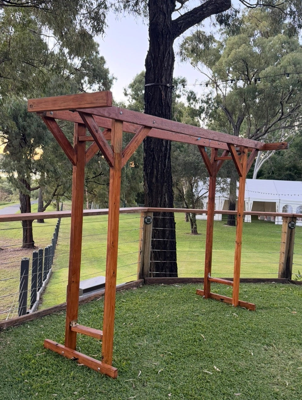 Custom made by RVH, polished timber four post double arbor. Weddings Rockhampton. Rockhampton Vintage Hire