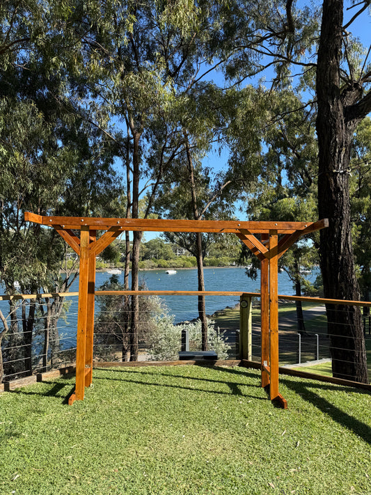 Custom made by RVH, polished timber four post double arbor. Weddings Rockhampton. Rockhampton Vintage Hire
