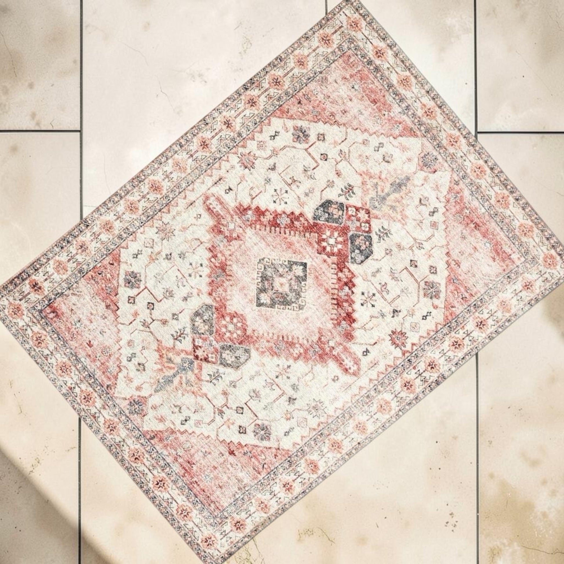 This large rug has a combination of pink, creamed and natural colours mixed in a gorgeous on trend print. Rockhampton Vintage Hire