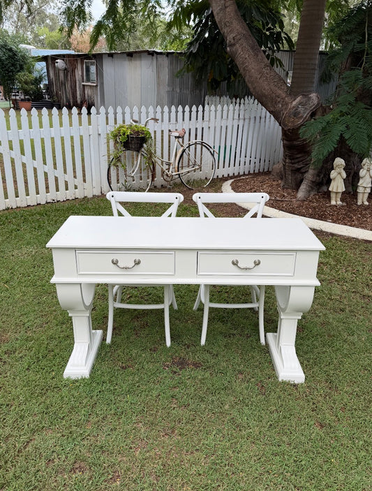 French Provincial or Hamptons-style white signing table with impressive pedestal legs & drawers. Pair with white cross back chairs.  Wedding, event & party hire.  Rockhampton Vintage Hire 